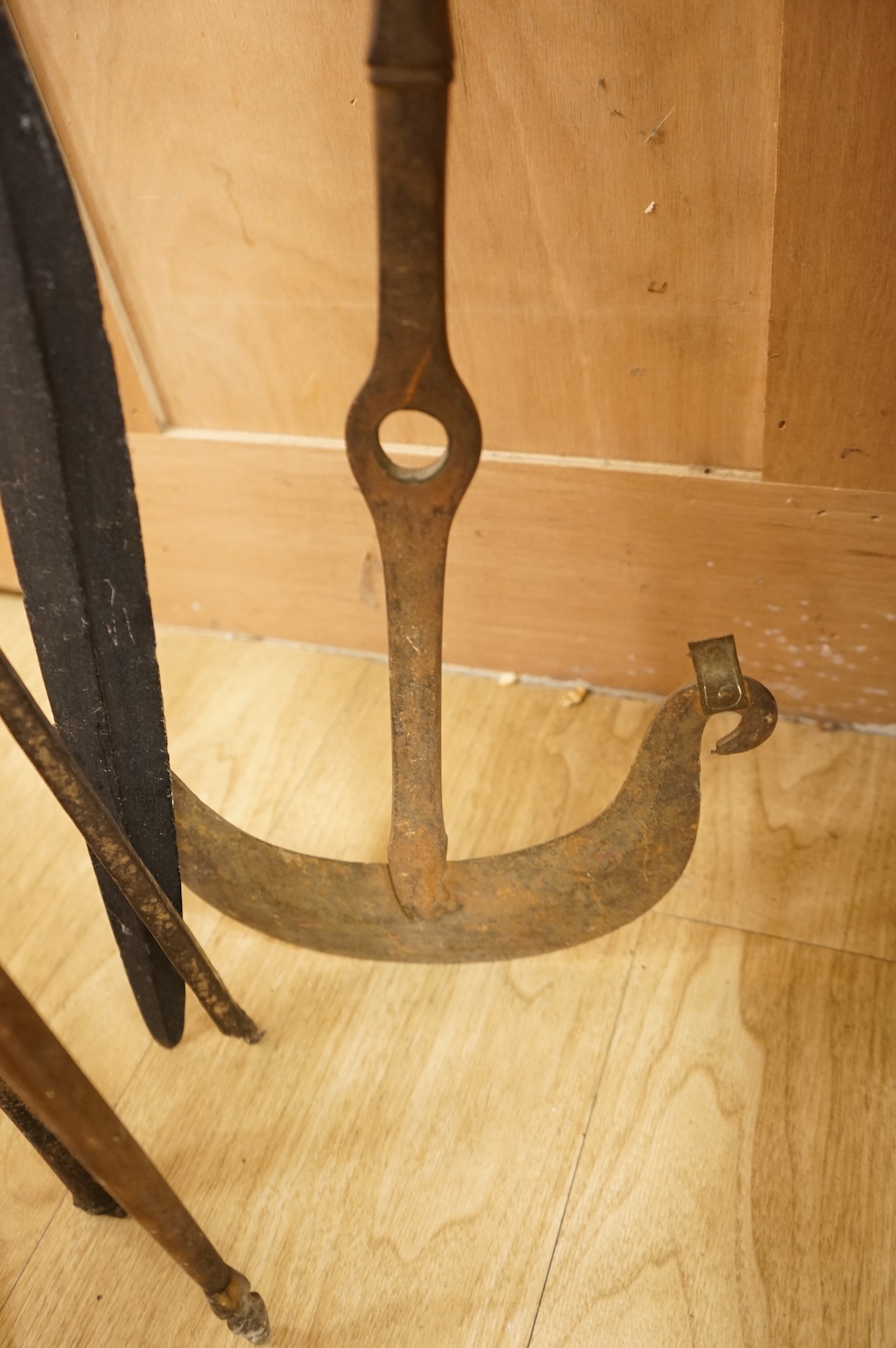 A collection of tribal spears, a fish hook, a cased snooker cue, etc.
